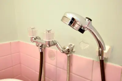 a shower in a bathroom with a pink at Yahiro Skytree House in Tokyo