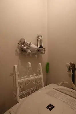 a bathroom with a sink and a toilet in a room at Yahiro Skytree House in Tokyo