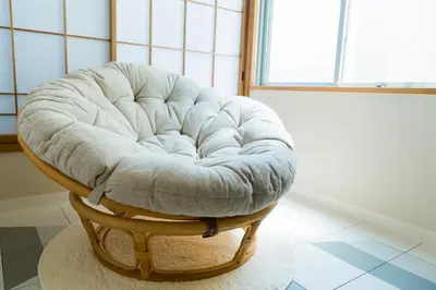 a white chair sitting in a room with a window at KAGO 34 Tokyo by Shukuba HOTEL in Tokyo