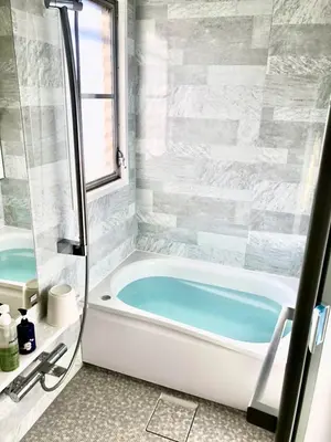 a bathroom with a bath tub and a window at SHINJUKU 5-ROOM Family house in Tokyo