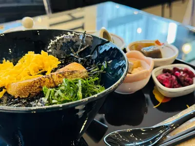 a bowl of food on a table with bowls of food at HOTEL SUI KANDA by ABEST in Tokyo