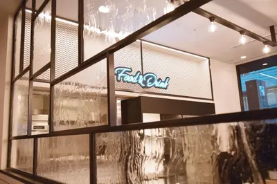 a store window with a firmon sign on it at HOTEL SUI KANDA by ABEST in Tokyo