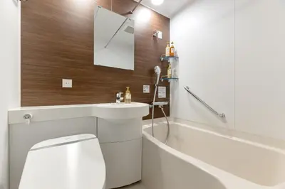 a bathroom with a toilet and a sink and a bath tub at ICI HOTEL Asakusabashi in Tokyo
