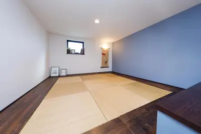 an empty room with a wooden floor and white walls at Stylewood Sangenjaya by Tranova in Tokyo