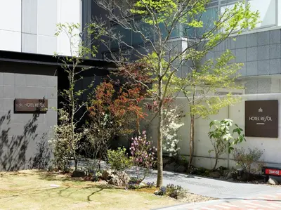 a tree in front of a building at Hotel Resol Akihabara in Tokyo