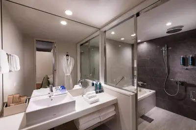 a bathroom with a sink and a shower at DoubleTree by Hilton Tokyo Ariake in Tokyo