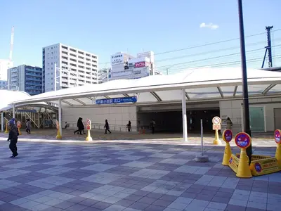 a group of people walking in front of a building at Cypressinn Tokyo in Tokyo
