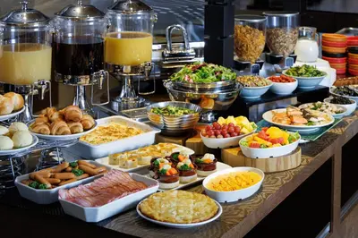 a buffet filled with lots of different types of food at remm Tokyo Kyobashi in Tokyo