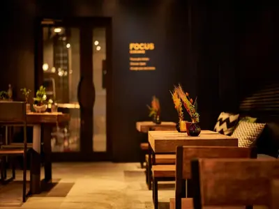 a restaurant with tables and chairs and a dining room at Focus Kuramae in Tokyo
