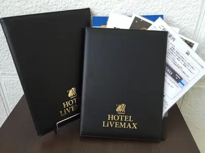 two black boxes sitting on top of a table at HOTEL LiVEMAX Ueno-Ekimae in Tokyo