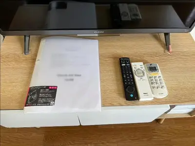 two remote controls sitting on top of a box at Urban Core Shikano 401 in Tokyo