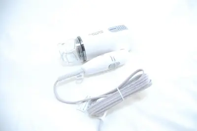 a hair dryer and a razor on a white background at Urban Core Shikano 401 in Tokyo