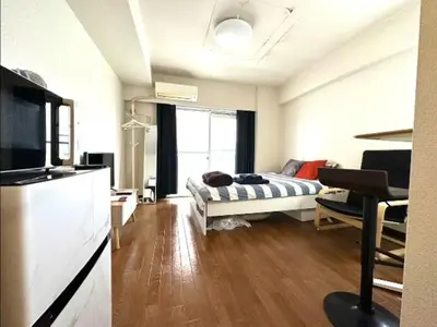 a room with a bed and a couch in a room at Urban Core Shikano 401 in Tokyo