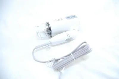 a hair dryer and a hair brush on a white counter at Urban Core Shikano 501 in Tokyo