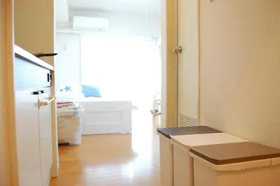 a room with a door to a bedroom with a bed at Urban Core Shikano 501 in Tokyo