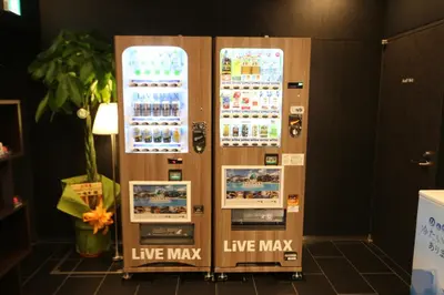 a drink vending machine in a room at HOTEL LiVEMAX Takadanobaba Ekimae in Tokyo