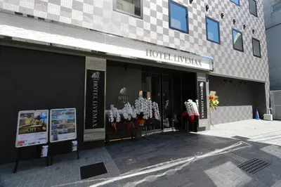 a store front of a high rise building at HOTEL LiVEMAX Takadanobaba Ekimae in Tokyo