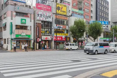 a busy city street with cars on a crosswalk at Evergreen hotel ichigaya luxe in Tokyo