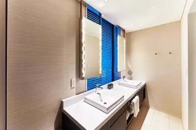 a bathroom with two sinks and a mirror at The Gate Hotel Tokyo by Hulic in Tokyo