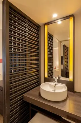 a bathroom with a sink and a mirror at Hotel Keihan Tokyo Yotsuya in Tokyo
