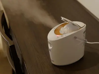 a toaster sitting on top of a wooden table at Hotel Keihan Tokyo Yotsuya in Tokyo