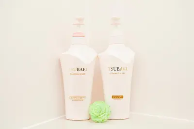 three bottles of koshiki moroccan shower cream and a green ball at Nagomi House in Tokyo