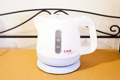 a white electric mixer sitting on a table at Nagomi House in Tokyo