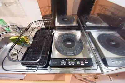 a counter top with a laptop on top of it at Yoyogi House in Tokyo