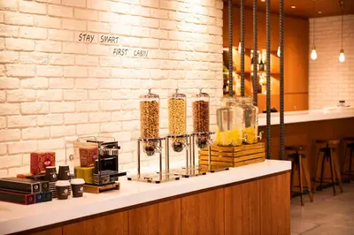a counter in a restaurant with aasteryasteryasteryasteryasteryasteryasteryasteryastery at First Cabin Ichigaya in Tokyo