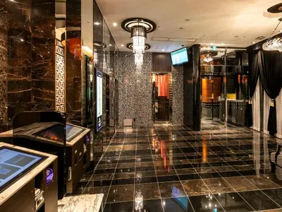 a lobby of a store with a tiled floor at APA Hotel Nihombashi Bakurocho Ekimae in Tokyo