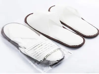 a pair of white shoes in a plastic bag at APA Hotel Nihombashi Bakurocho Ekimae in Tokyo