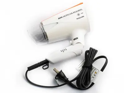 a hair dryer with a cord and a blow dryer at APA Hotel Nihombashi Bakurocho Ekimae in Tokyo