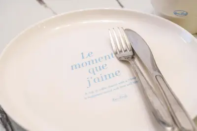a fork and knife on a plate on a table at The Emilio 102 Shinjuku Near Shibuya in Tokyo