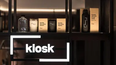 a shelf with a bottle of alcohol and a bottle of whiskey at Bespoke Hotel Shinjuku in Tokyo