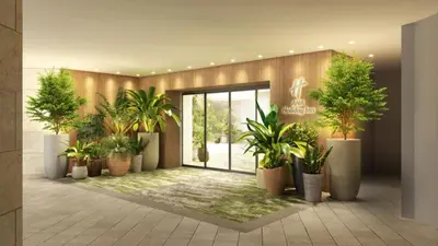 a lobby with a bunch of potted plants at ANA Holiday Inn Tokyo Bay by IHG in Tokyo