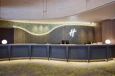 a lobby of a hotel with a reception desk at ANA Holiday Inn Tokyo Bay by IHG in Tokyo