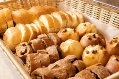 a basket filled with different types of pastries at Pearl Hotel Shinjuku Akebonobashi in Tokyo