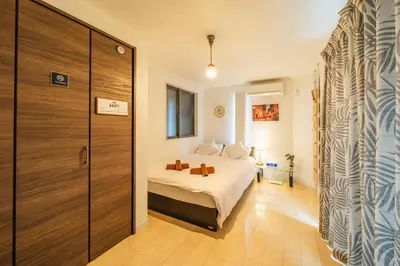 a bedroom with a bed and a large closet at QiQi House Tokyo まるごと新築一軒家宿 Spacious New Home, 8 Guests, Easy Airport & Disney Access in Tokyo