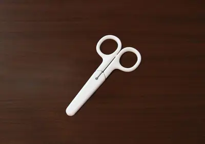 a white pair of scissors sitting on top of a table at Hotel Trend Asakusa Tawaramachi in Tokyo