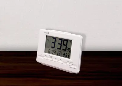 an alarm clock sitting on top of a table at Hotel Trend Asakusa Tawaramachi in Tokyo