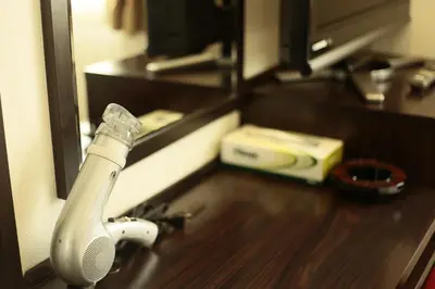 a blow dryer on a counter in a hotel room at Hotel New Takada in Tokyo