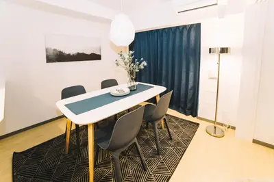 a dining room with a table and chairs at Universal Haneda in Tokyo