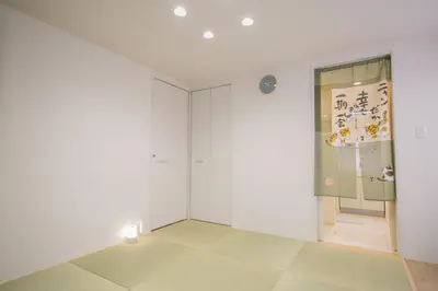 a white room with a staircase and a window at Takadanobaba 3-1F in Tokyo