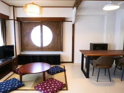 a room with a table and chairs and a dining room at Amber Iidabashi in Tokyo