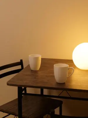 two cups sitting on top of a wooden table at Amber Iidabashi in Tokyo
