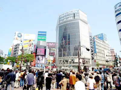 a large crowd of people crossing a busy city street at Shibuya Stay Tokyo A101 in Tokyo