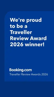 a blue sign that says were proud to be a traveller reviewagency winner at Shibuya Stay Tokyo A102 in Tokyo