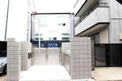 a building with white tiles on the side of it at Shibuya Stay Tokyo A202 in Tokyo