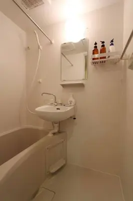 a bathroom with a sink and a bath tub at Shibuya Stay Tokyo A203 in Tokyo