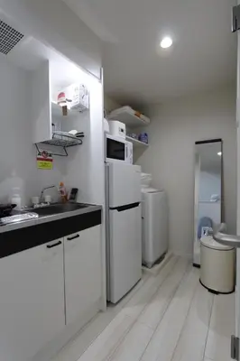 a white kitchen with a sink and white appliances at Shibuya Stay Tokyo B204 in Tokyo